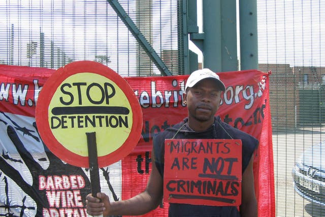 Anicet Mayela during a protest at Campsfield House detention centre near Oxford (Simon Evans/PA)