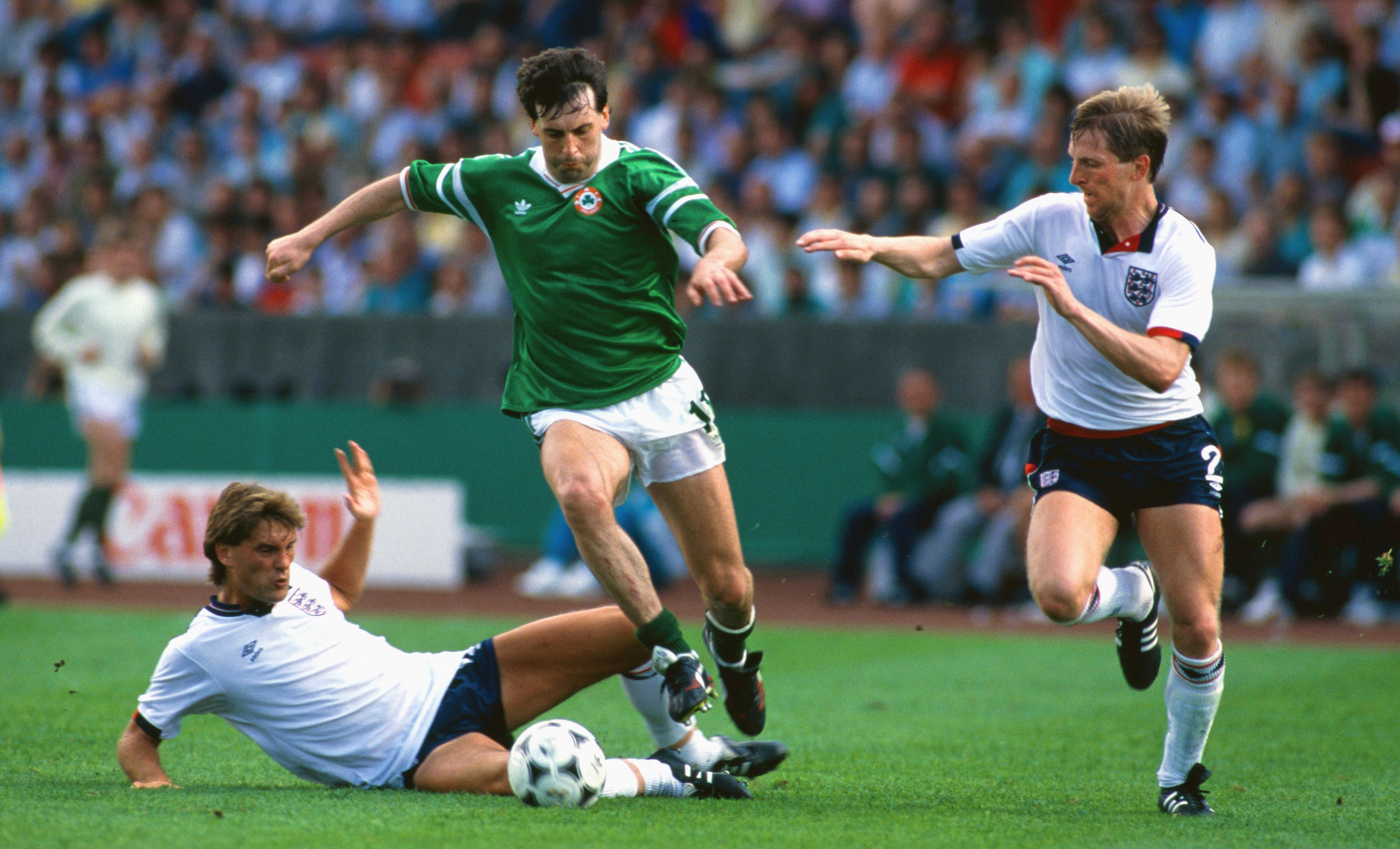 Ireland’s Tony Galvi skips past Glenn Hoddle and Gary Stevens in Stuttgart, West Germany during Euro ‘88