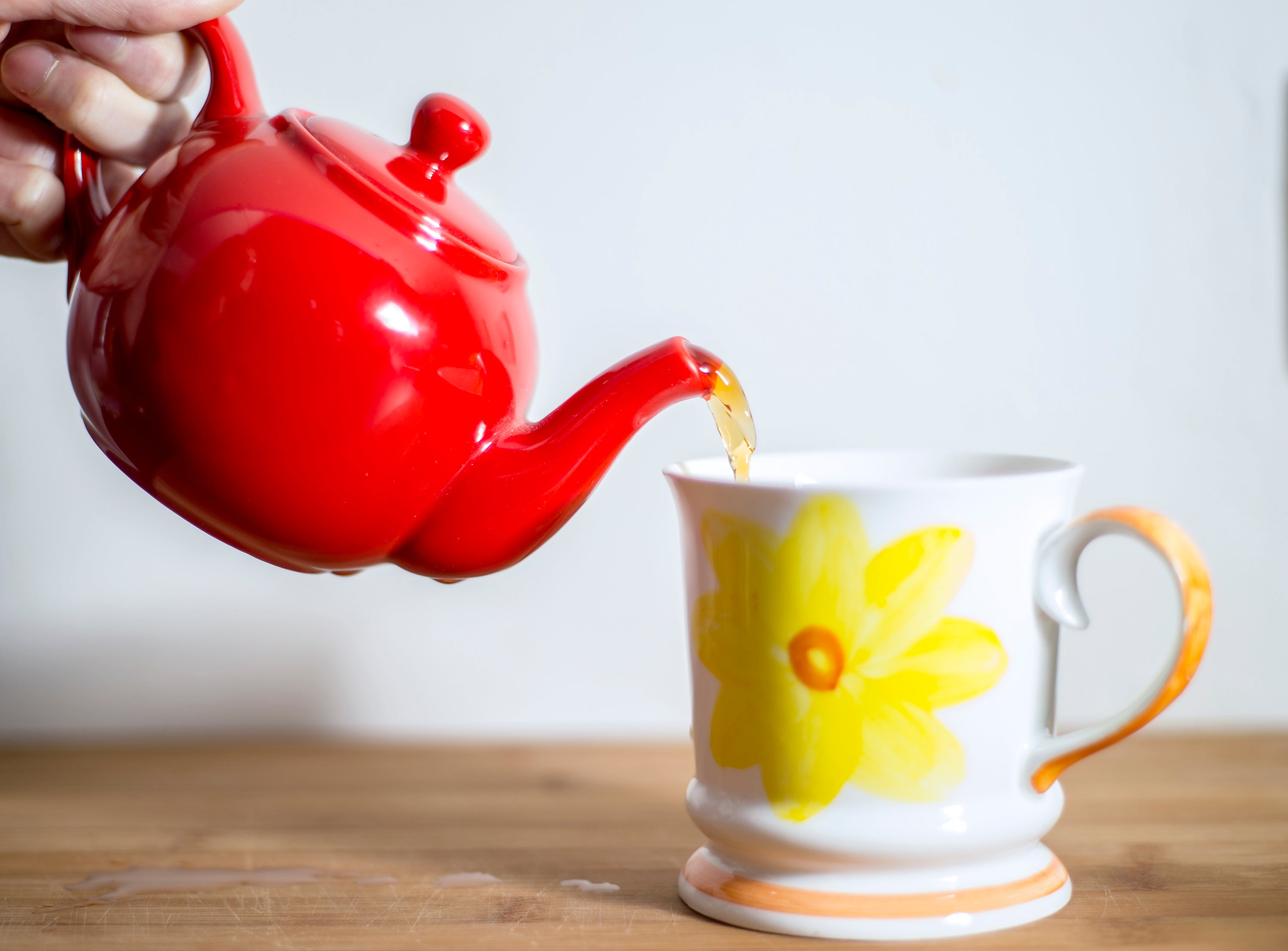 English breakfast tea being poured from a teapot