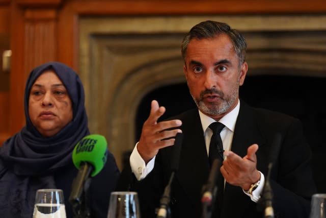 Solicitor Aamer Anwar with Shameem Akhtar during a press conference in Manchester in August (Owen Humphreys/PA)