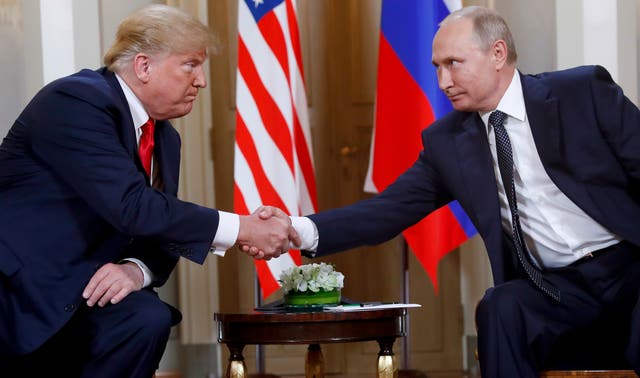 <p>A former FBI official warns Trump could be a Russian asset if he wins the election. Trump is pictured with Putin in 2018 </p>