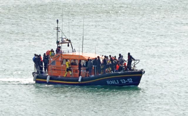 <p>A group of people thought to be migrants are brought in to Dover onboard an RNLI lifeboat following a small boat incident in the English Channel (Gareth Fuller/PA)</p>