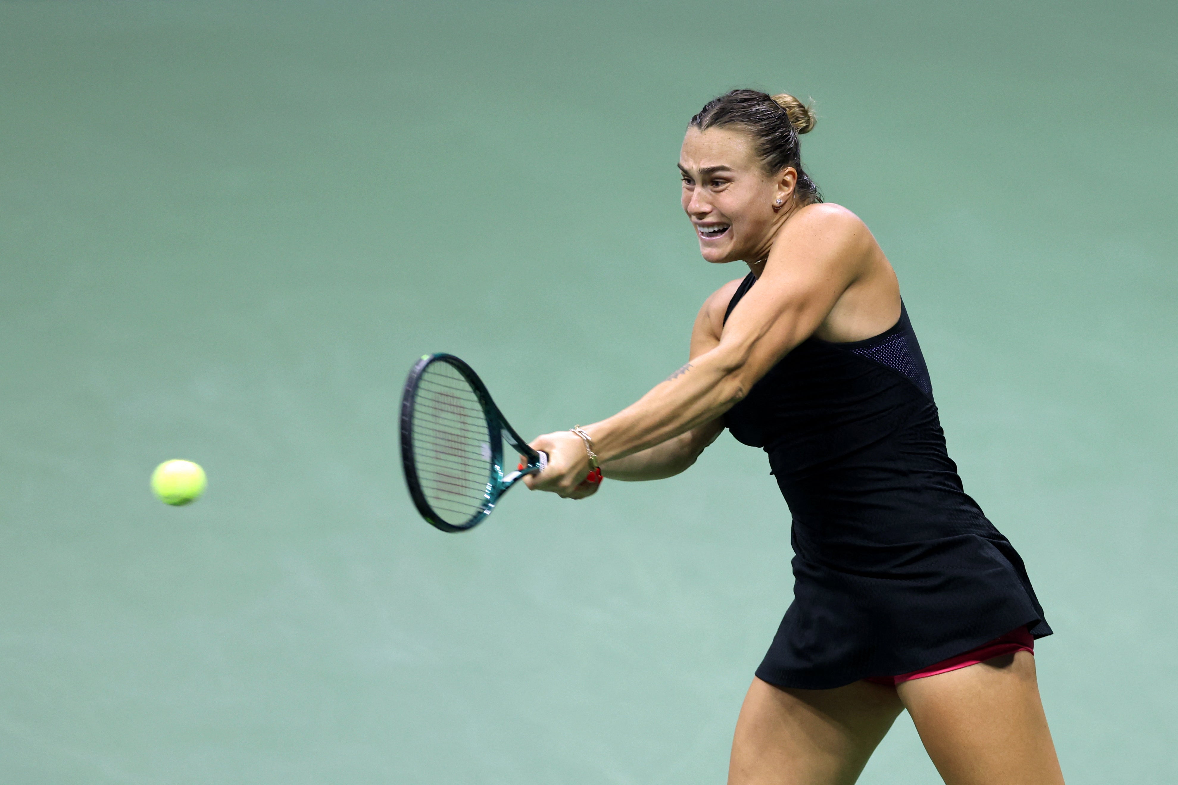 Belarus's Aryna Sabalenka plays a backhand return against USA's Emma Navarro