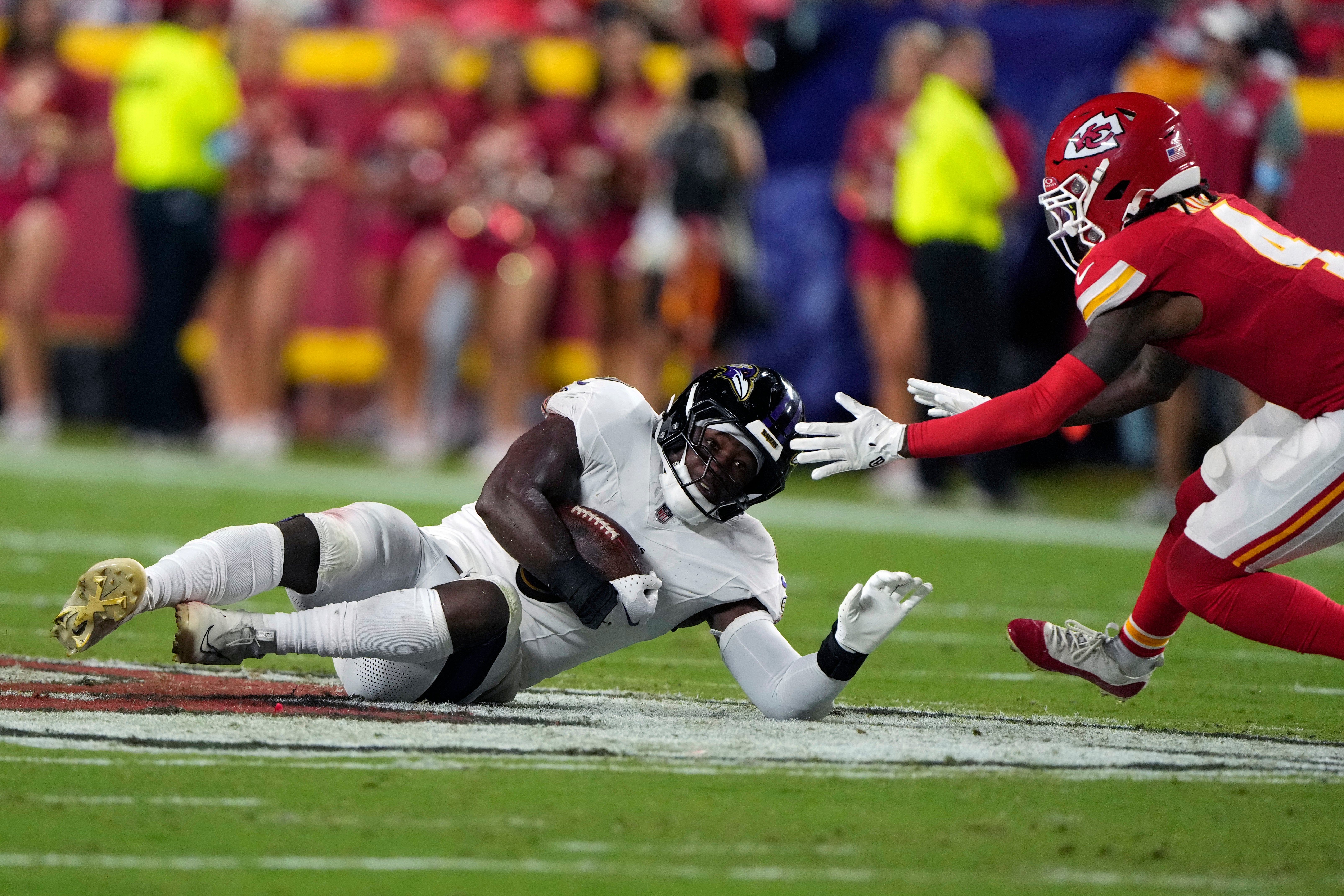 Baltimore Ravens inside linebacker Roquan Smith, left, intercepts a pass as Kansas City Chiefs wide receiver Rashee Rice defends during the first half of an NFL football game Thursday 5 September 2024. Rice’s mother has been accused of stealing a package from her neighbor