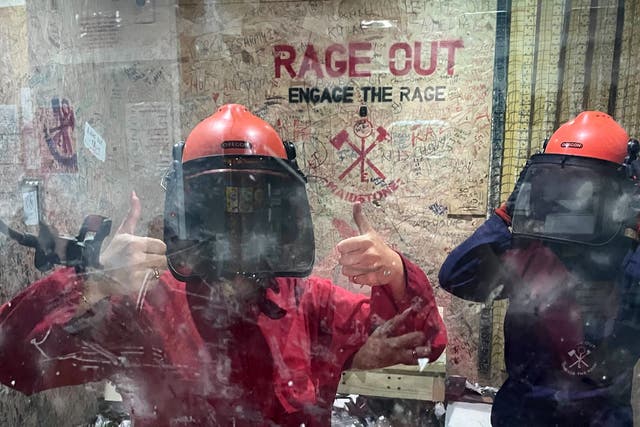 <p>Smashy smashy: Lydia Spencer-Elliott in her rage room with a friend</p>