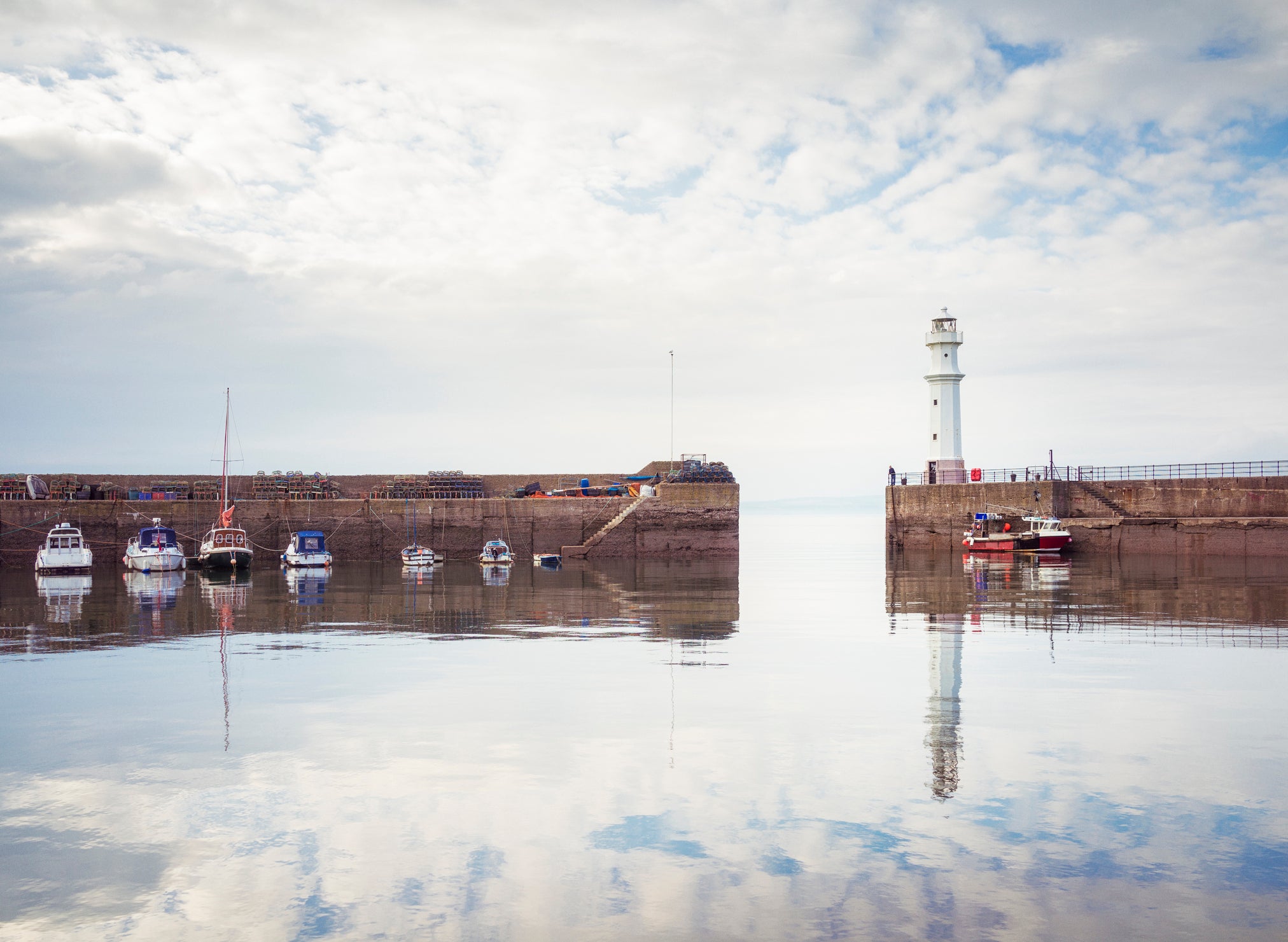 The lighthouse on the harbour walls of Newhaven harbour, part of Edinburgh’s Wardie Bay waterfront