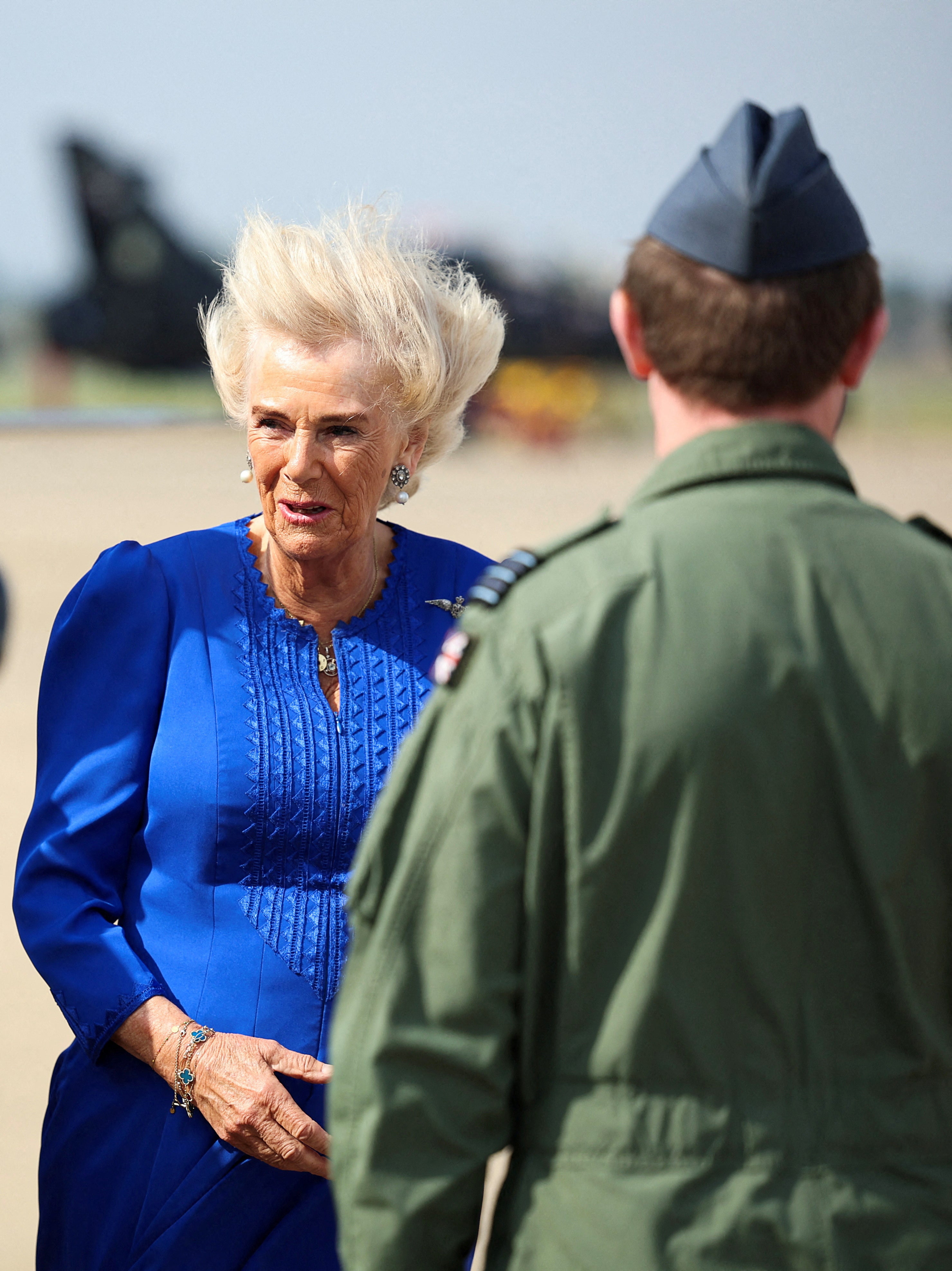 Queen Camilla braves the wind as she visits Northallerton RAF base