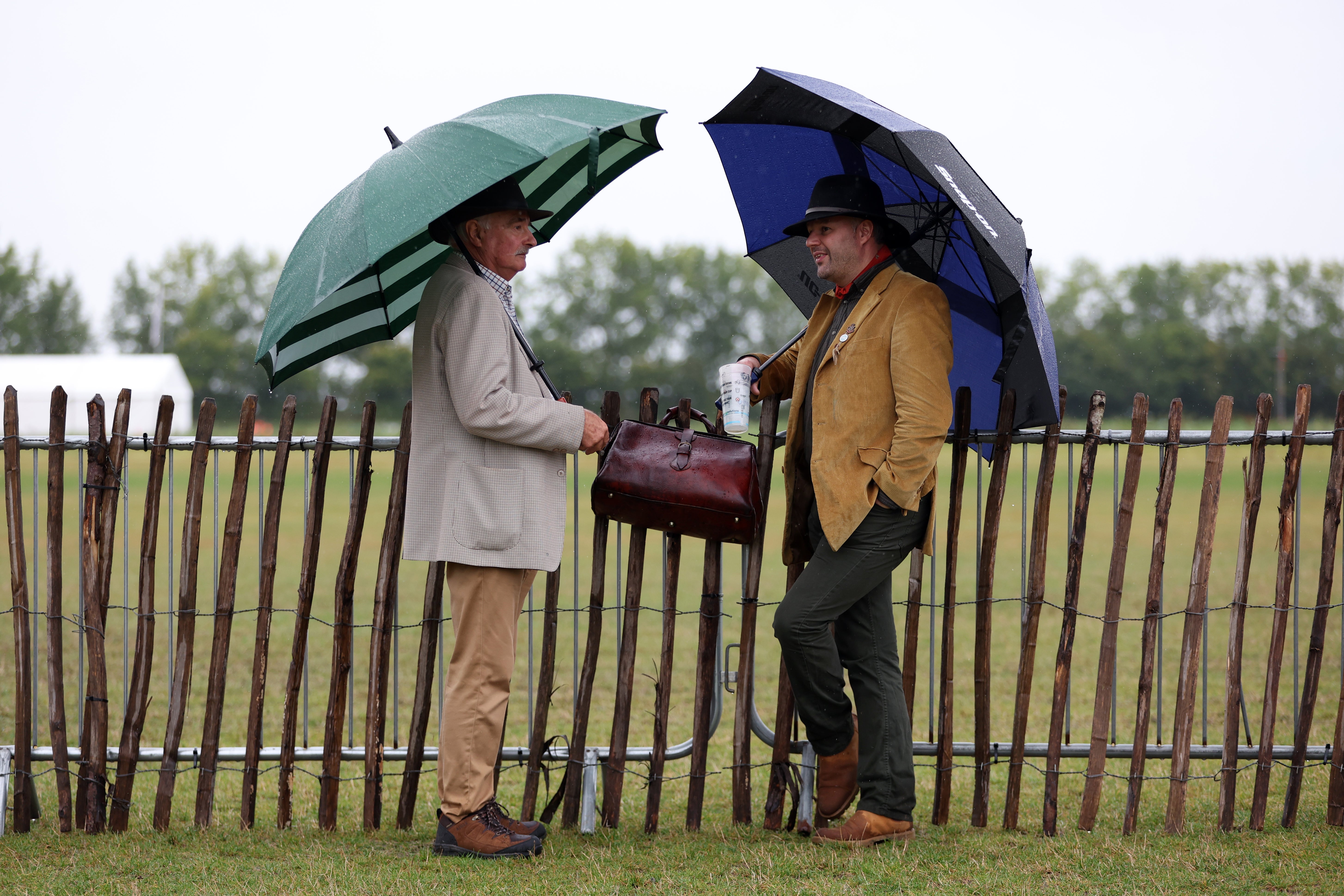 Historic motor enthusiasts are braving the wet weather in West Sussex