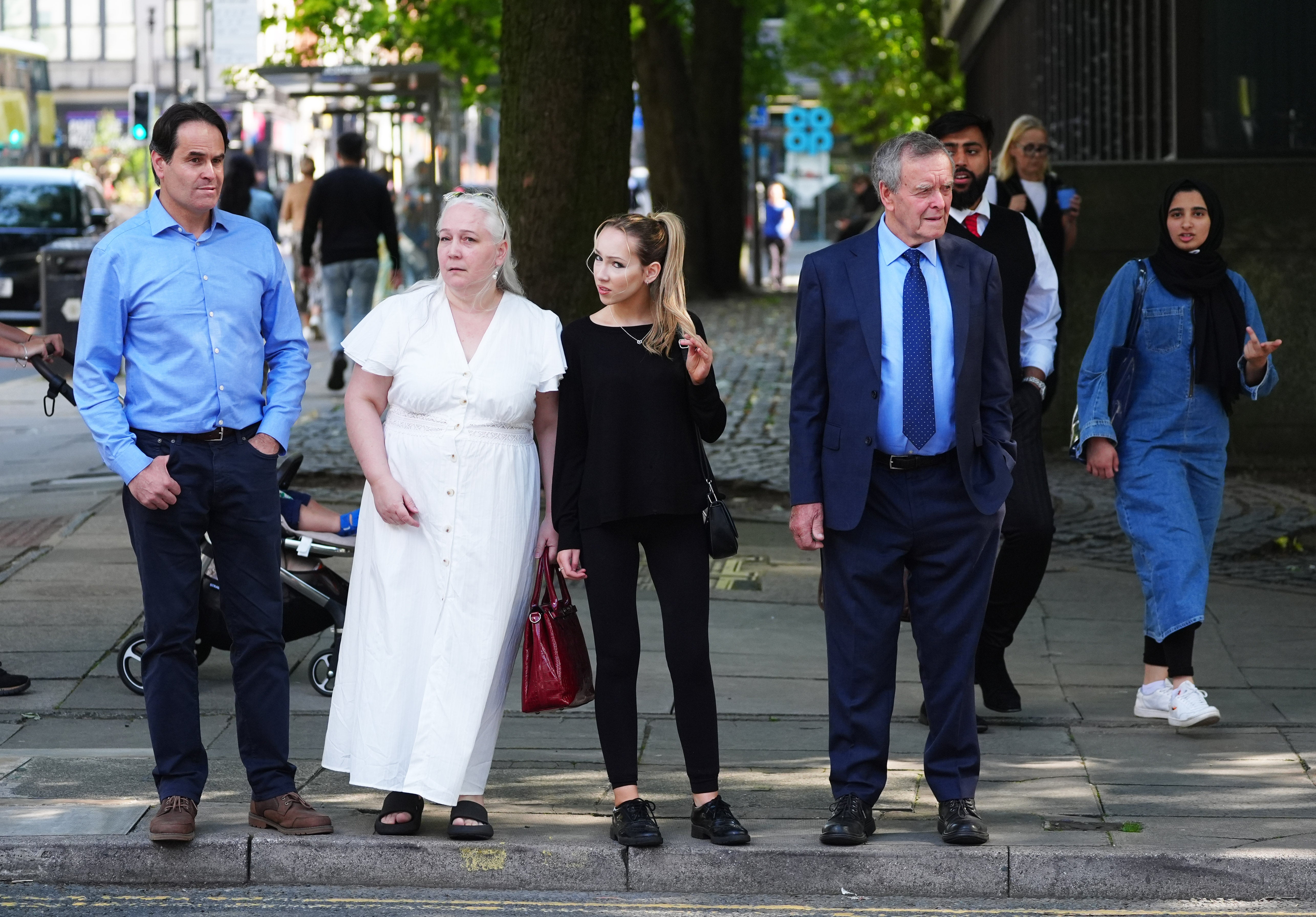 Paula Leeson's brother Neville (left) and father Willy (right) outside Manchester Civil Justice Centre