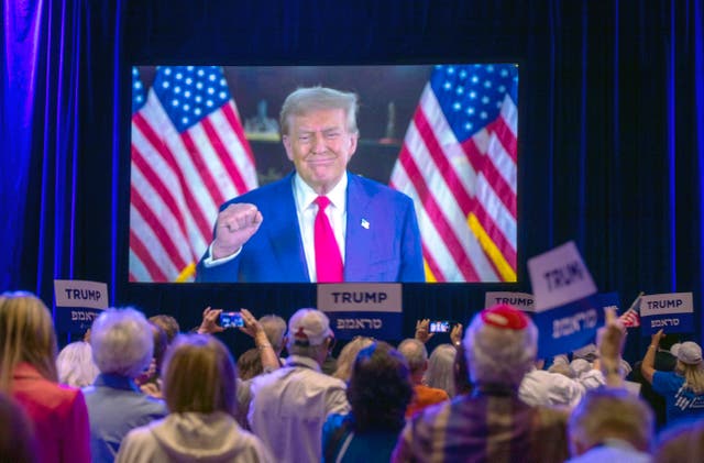 <p>Republican presidential nominee Donald Trump appears via live video feed at the Republican Jewish Coalition annual leadership summit on September 5 in Las Vegas </p>