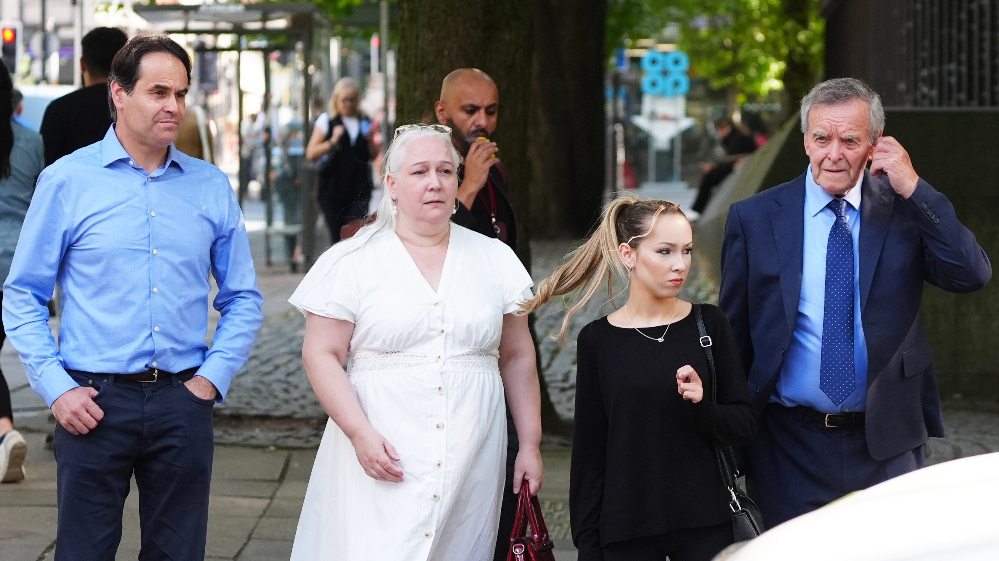 Paula Leeson's brother Neville Leeson (left) and father Willy Leeson (right) outside Manchester Civil Justice Centre