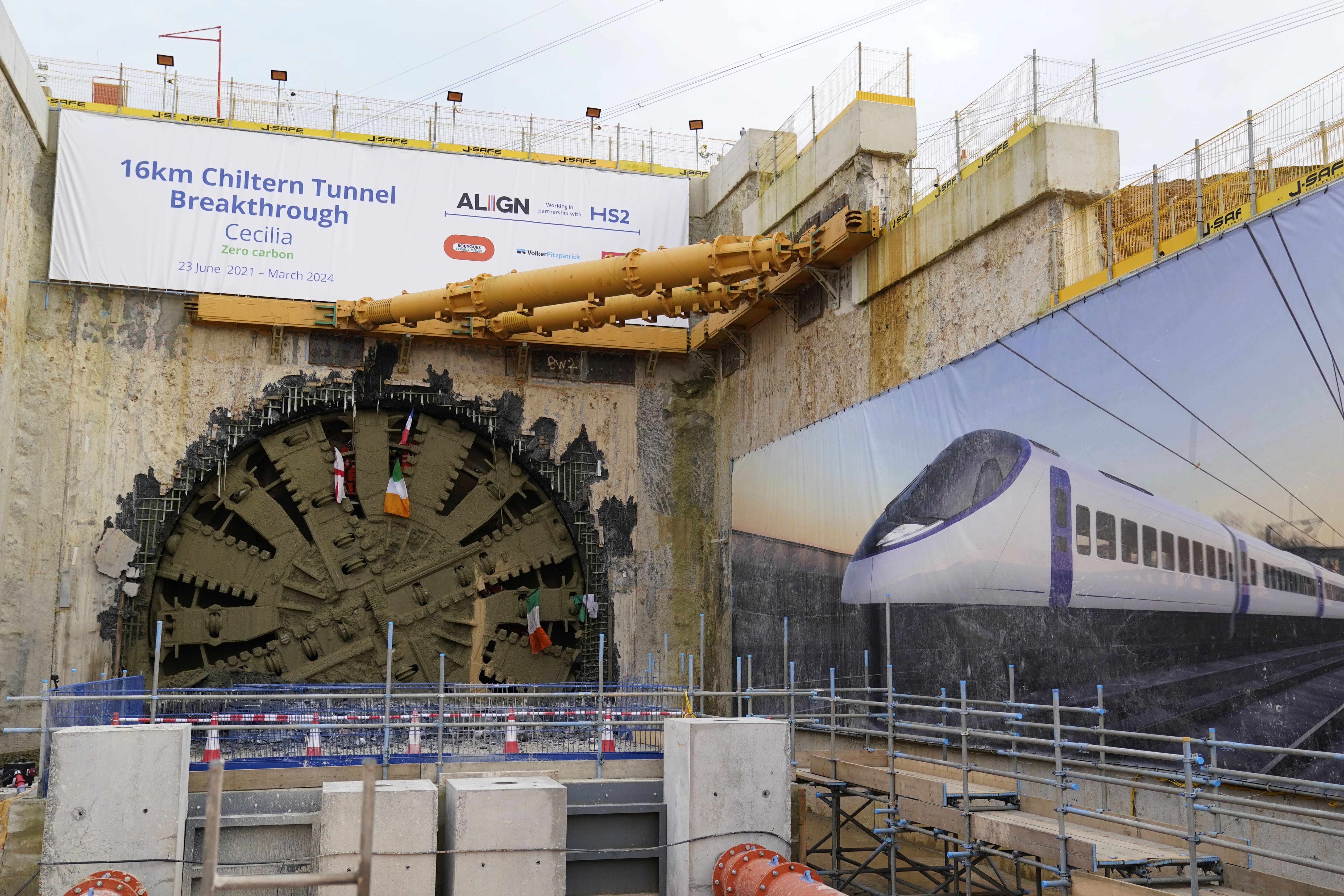 HS2 workers wave flags from the boring machine Cecelia (PA)