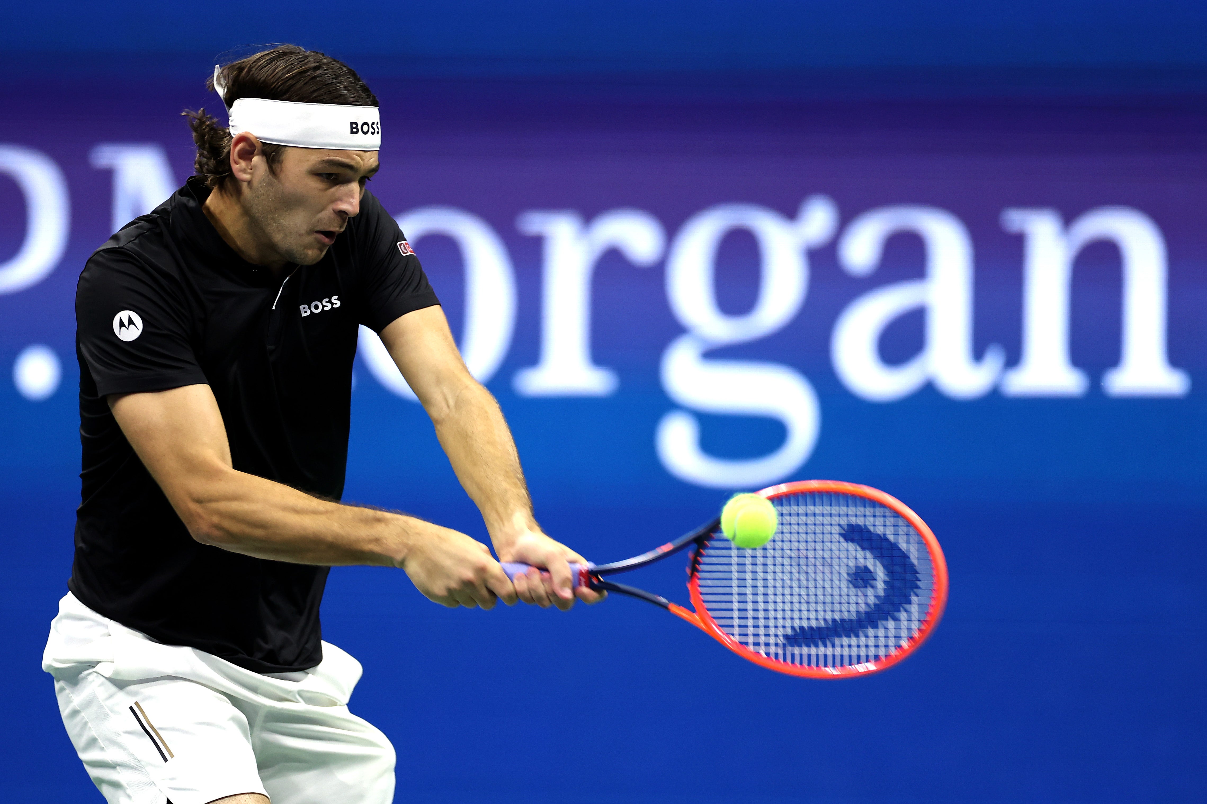 NEW YORK, NEW YORK – SEPTEMBER 06: Taylor Fritz of the United States hits a return against Frances Tiafoe of the United States during their men's singles semifinal match on day twelfth of the 2024 US Open at the USTA Billie Jean King National Tennis Center on September 6, 2024 in the Flushing neighborhood of the Queens borough of New York. (Photo by Sarah Stier/Getty Images)