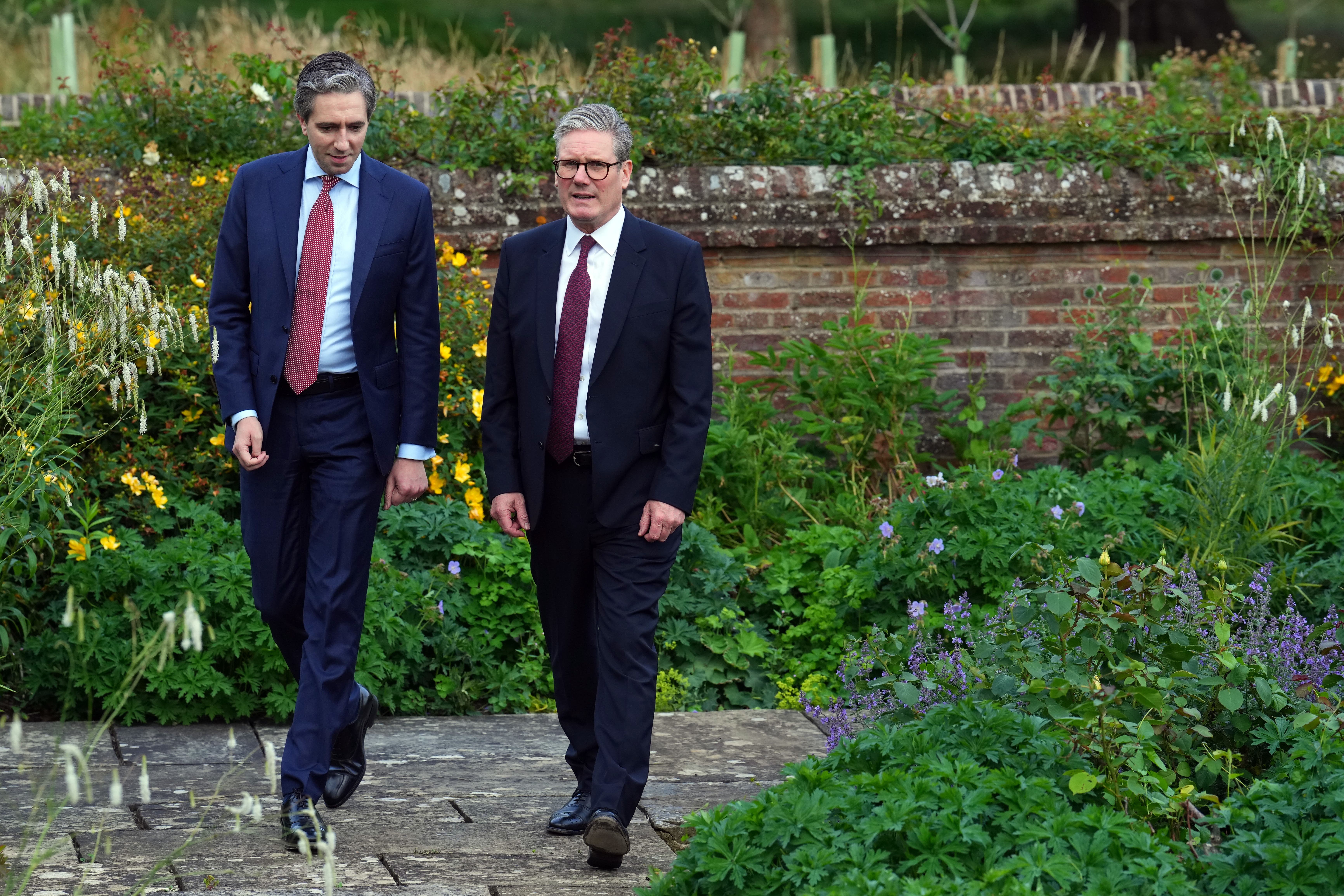 Prime Minister Sir Keir Starmer (right) with Taoiseach Simon Harris at Chequers in July (Carl Court/PA)