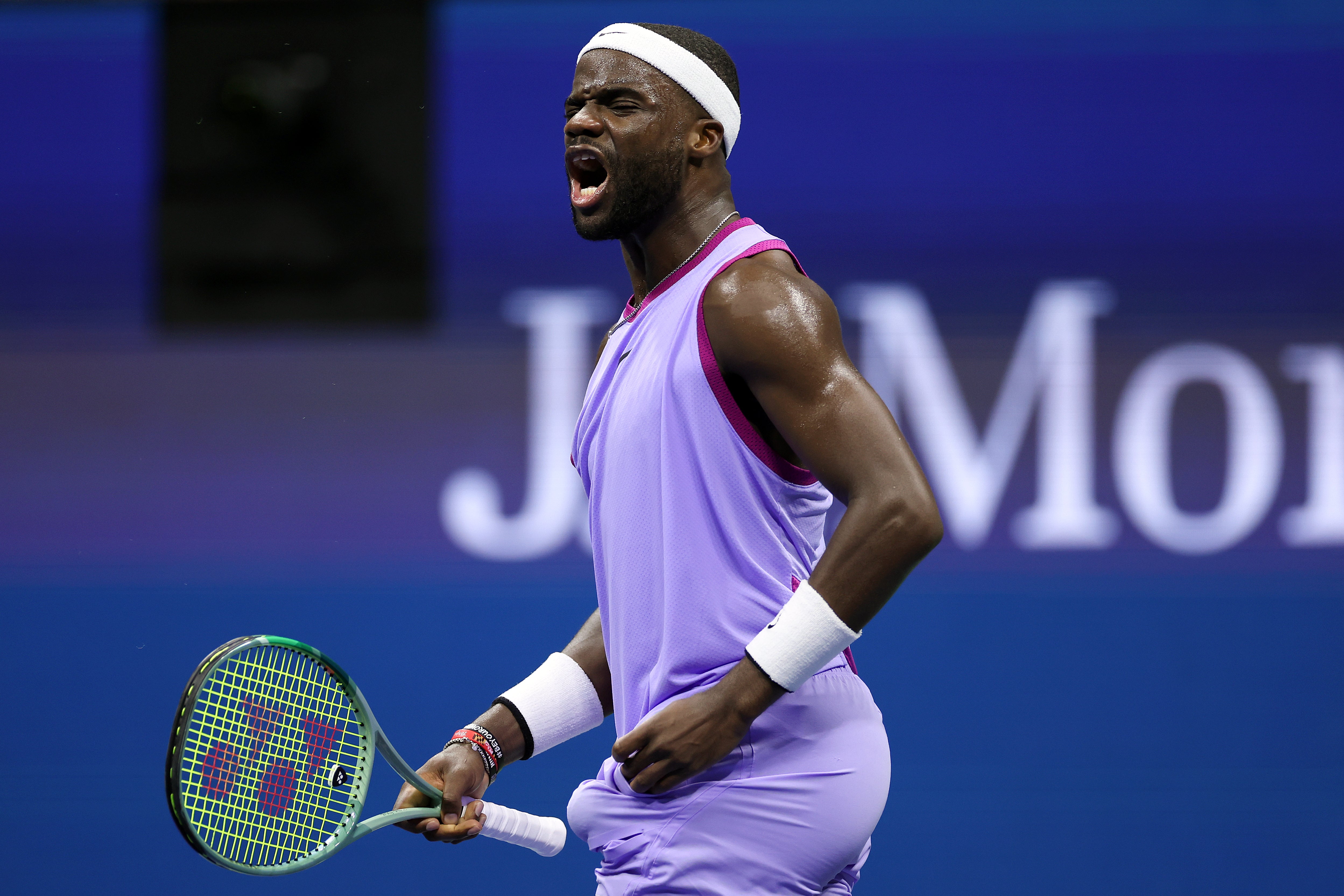 Frances Tiafoe celebrates after winning a point against Fritz