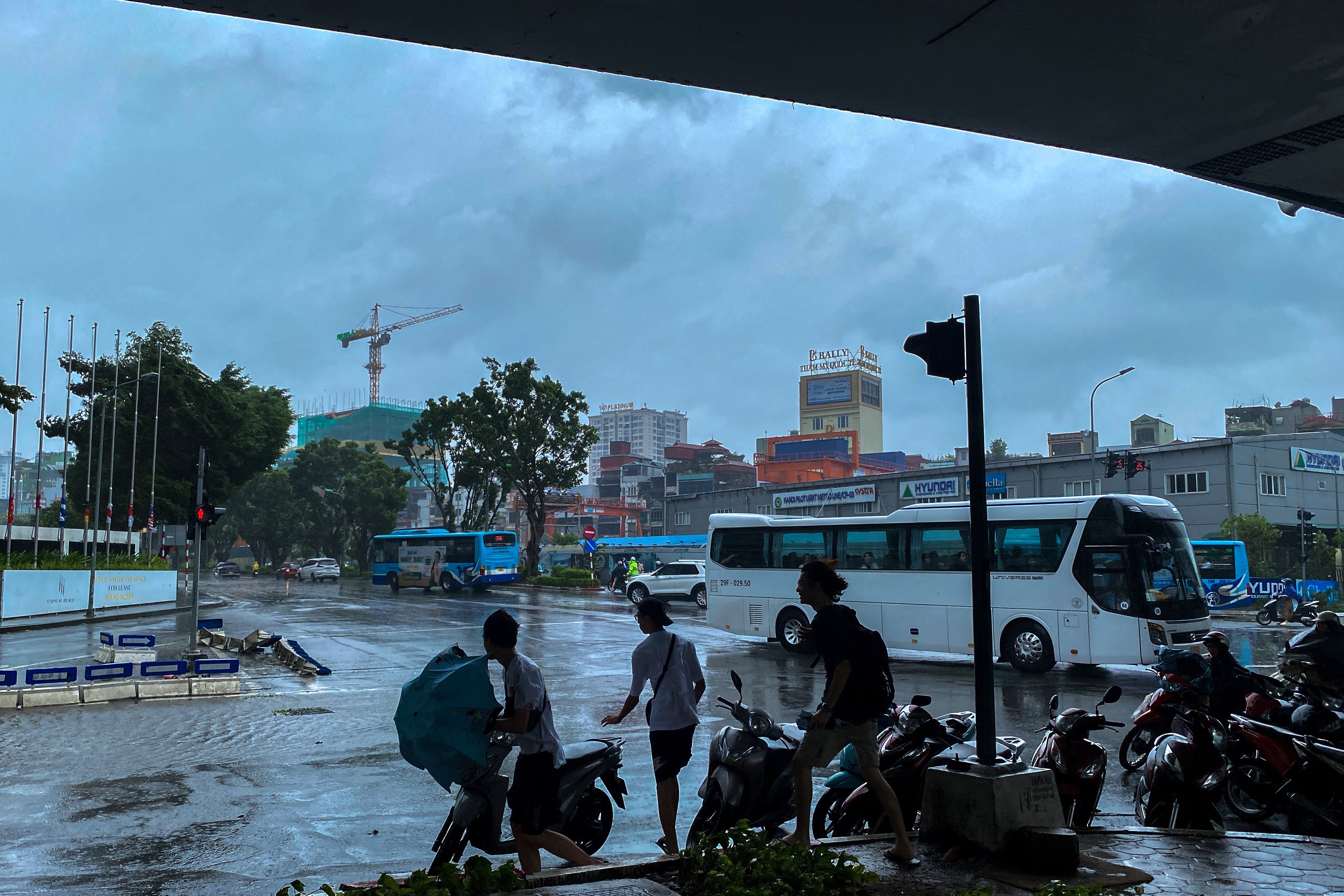 People take shelter under a bridge amid the impact of Typhoon Yagi, in Hanoi, Vietnam, 7 September 2024