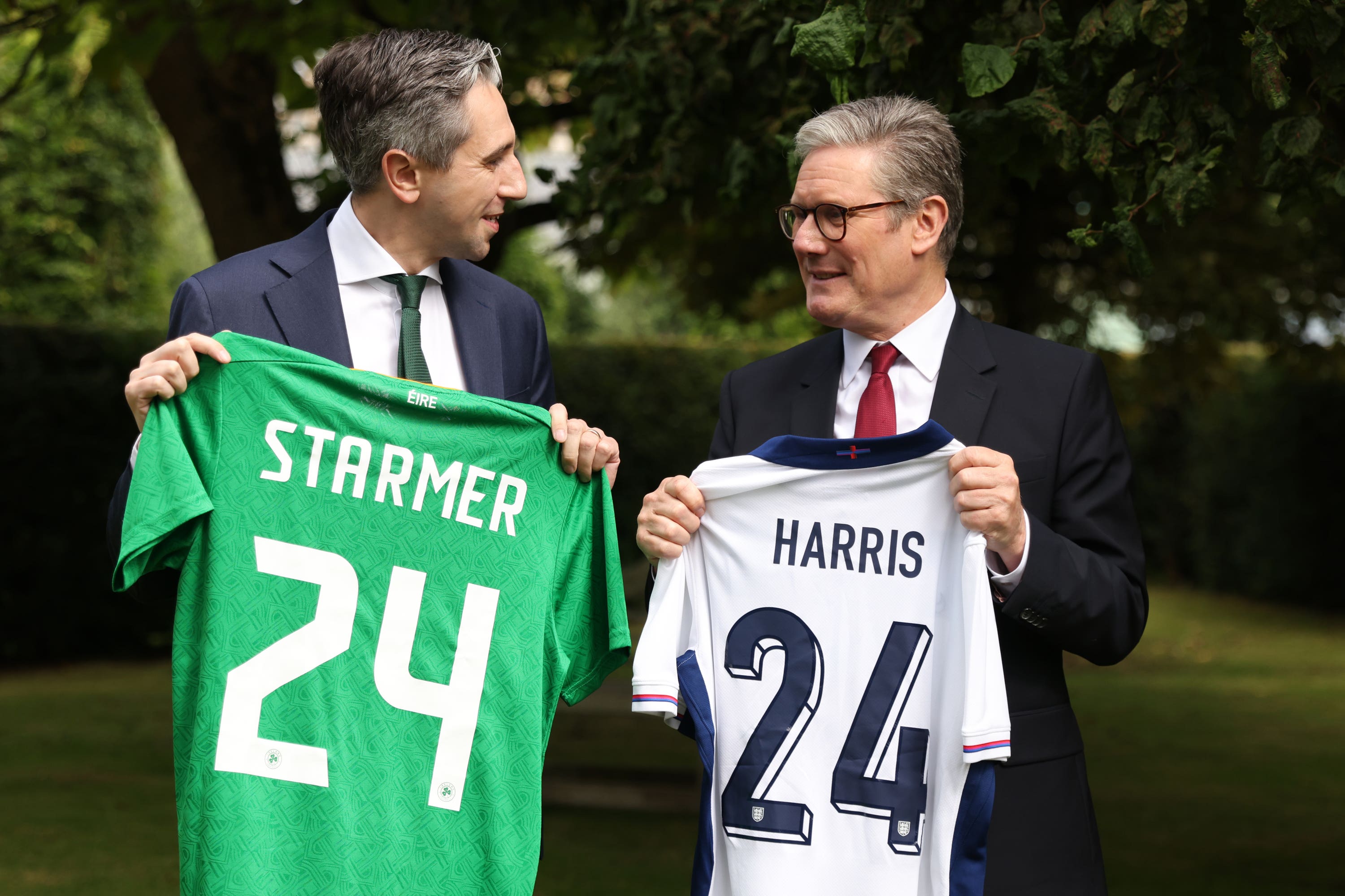 Taoiseach Simon Harris and Prime Minister Sir Keir Starmer were given football shirts with their names on (Peter Morrison/PA)