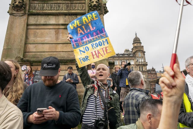 <p>Activists from Stand Up To Racism Scotland gathered in George Square, Glasgow (Jane Barlow/PA)</p>