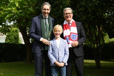 Dublin boy treated for rare illness presents premiers with football shirts