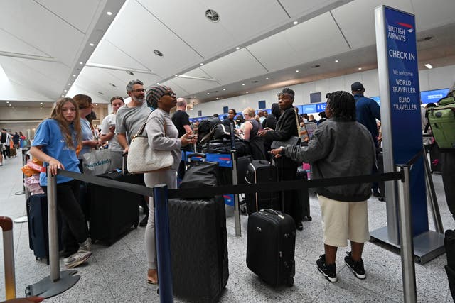 <p>Passengers at the British Airways check-in area of Gatwick Airport  </p>