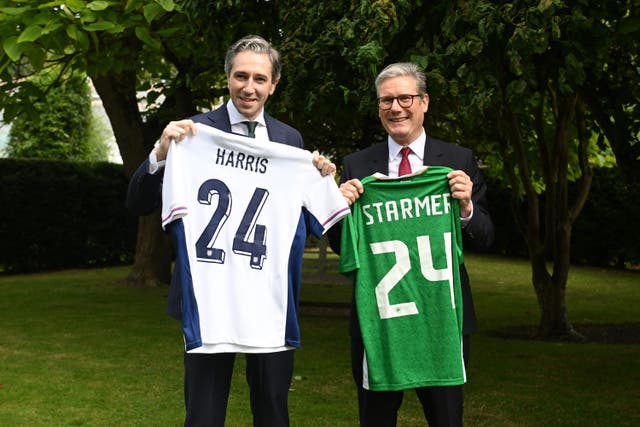 <p>Taoiseach Simon Harris and Prime Minister Sir Keir Starmer swapped personalised jerseys (Chalres McQuillan/PA)</p>