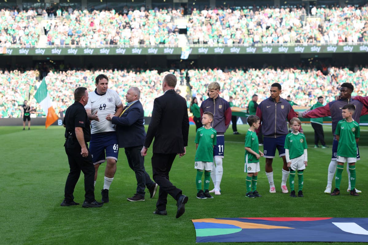 Pitch invader in England kit evades security to join line-up before Ireland clash