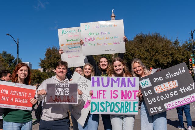 <p>Anti-abortion rights supporters take part in a "Rally for Life" march and celebration outside the Texas State Capitol on January 27, 2024, in Austin, Texas</p>