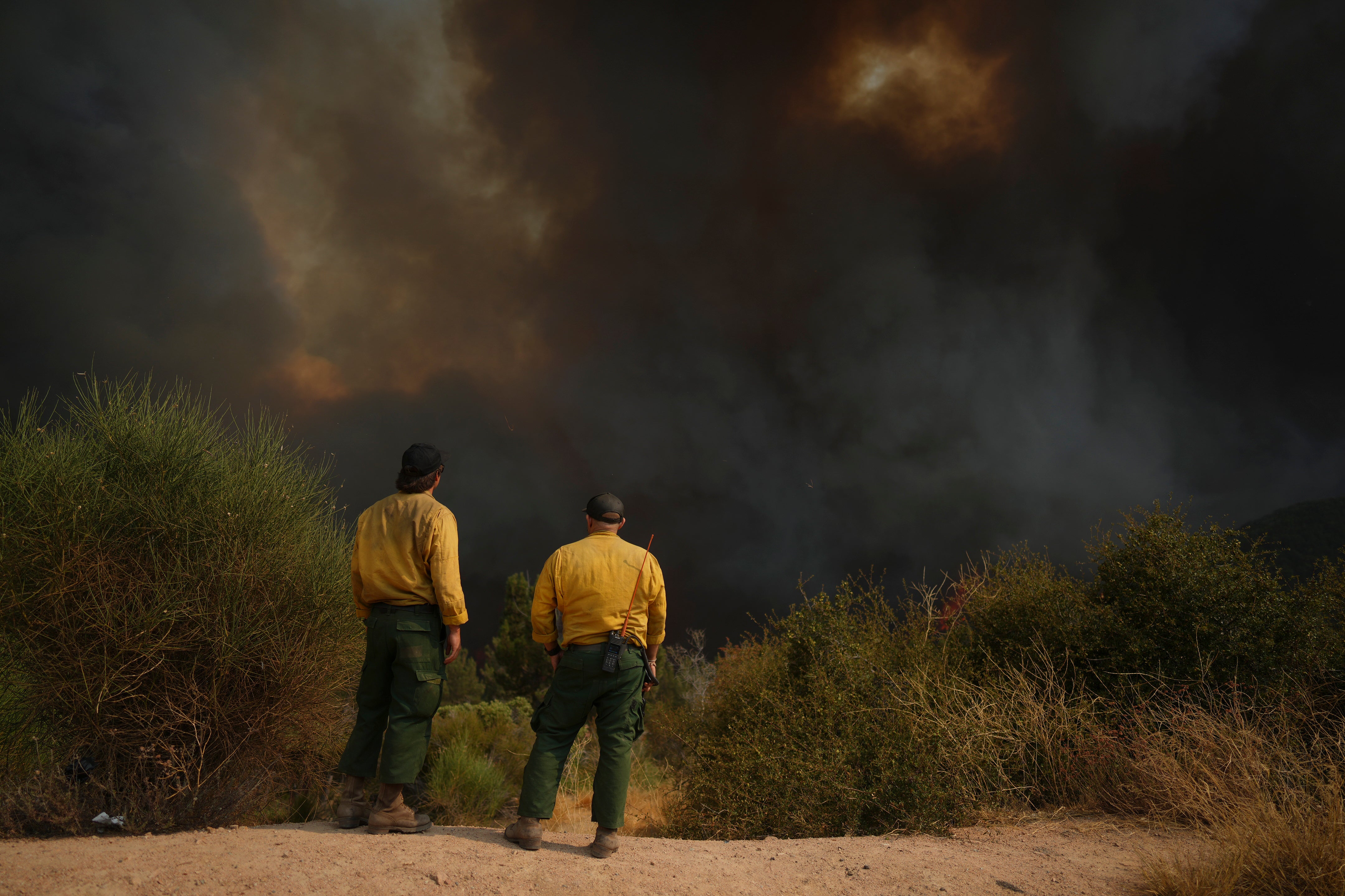 Fire crews monitor the Line Fire, Saturday, Sept. 7, 2024, in Running Springs, California