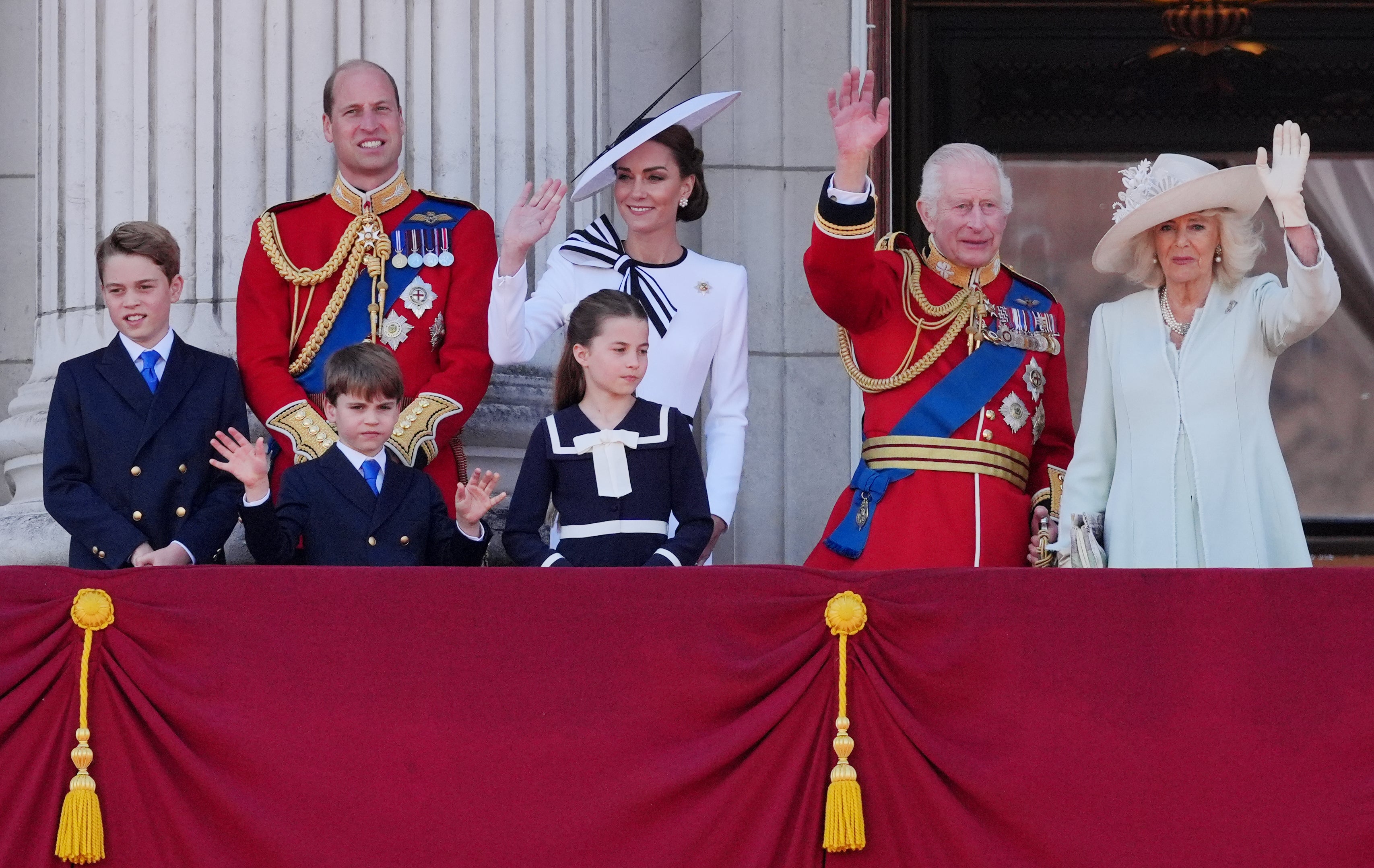 Kate and Charles with the royal family on the Palace balcony after Trooping the Colour in June.