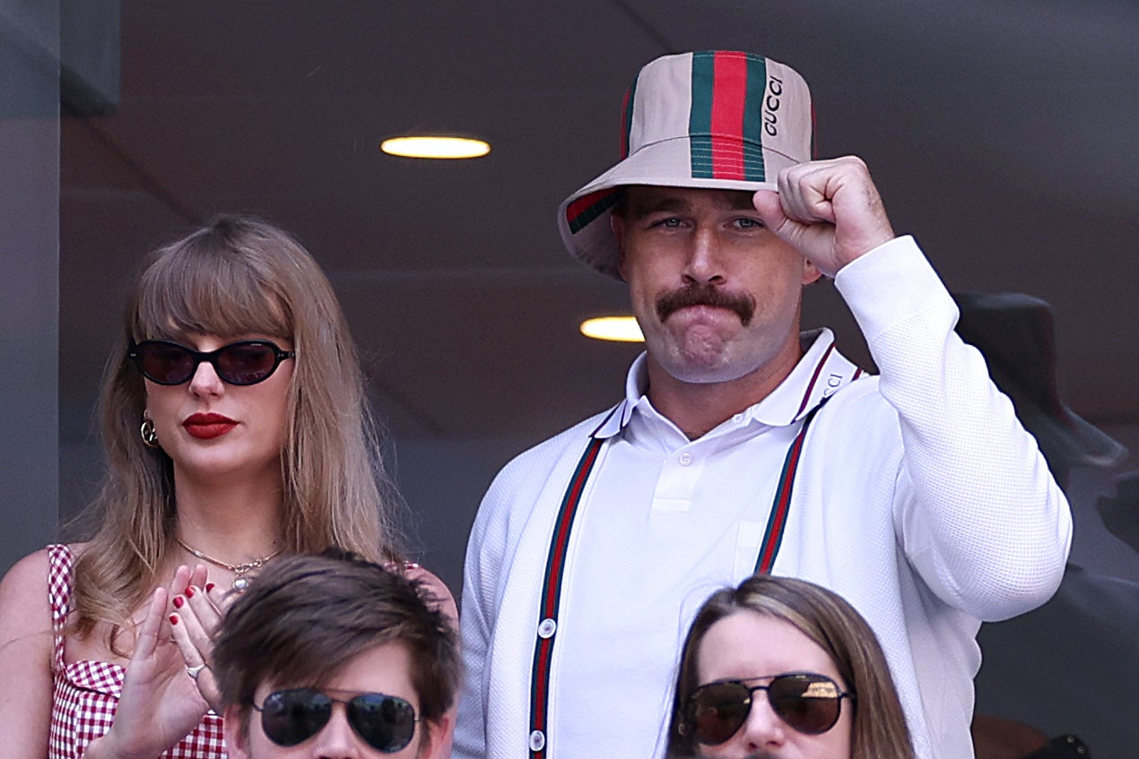 Swift wore a red and white checked dress, while her boyfriend sported a tan Gucci bucket hat.