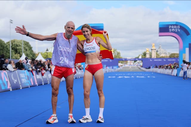 <p>Elena Congost (right) missed out on bronze after aiding her guide across the line </p>
