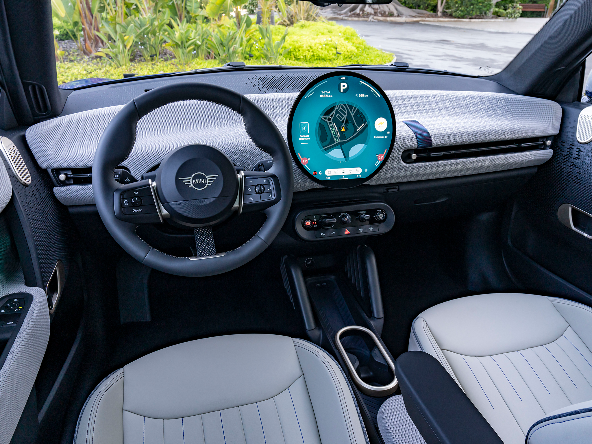 The Mini Cooper SE cabin is dominated by a circular, 9.5-inch OLED screen