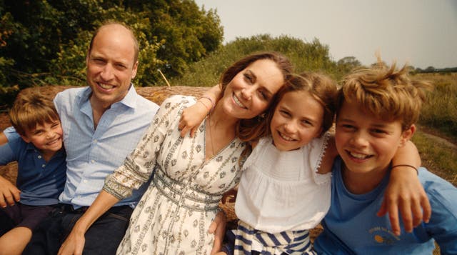 <p>The Wales family embracing one another in the footage released by Kate (Will Warr/Kensington Palace/PA)</p>