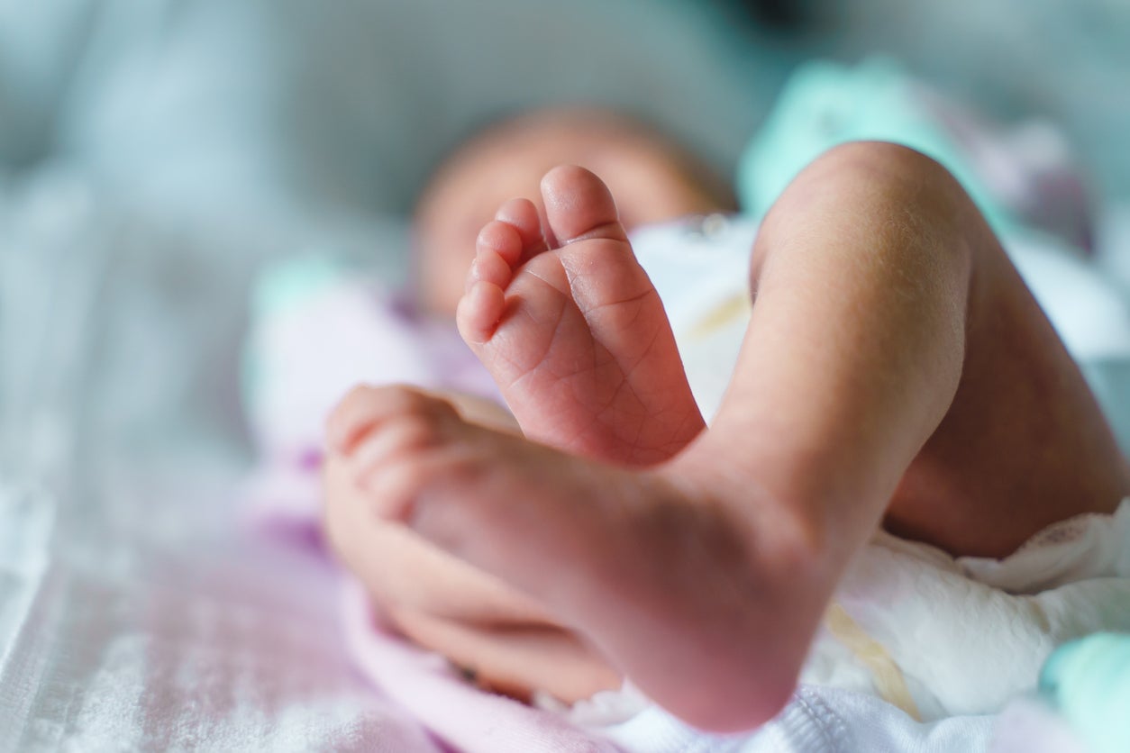 The feet of a newborn baby are seen on a bed. Sudden infant death syndrome, or SIDS, is responsible for the deaths of approximately 3,500 infants every year in the United States. Now, researchers across the country have identified certain metabolic biomarkers and SIDS.
