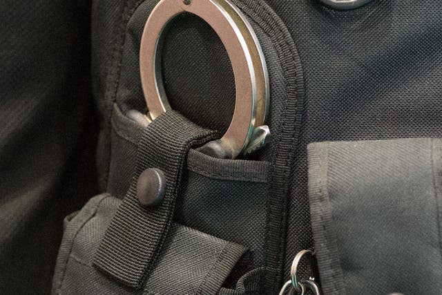 Police handcuffs on display (Aaron Chown/PA)