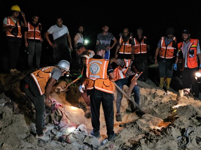 <p>Rescue workers look for survivors after Israeli airstrikes on a tent encampment of displaced Palestinians in Khan Yunis, Gaza, on 10 September 2024</p>