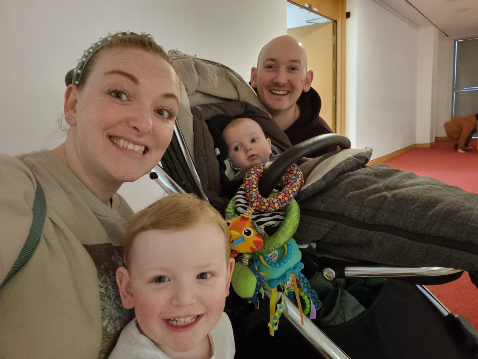 Dale, Ruby and their two children smiling at the camera