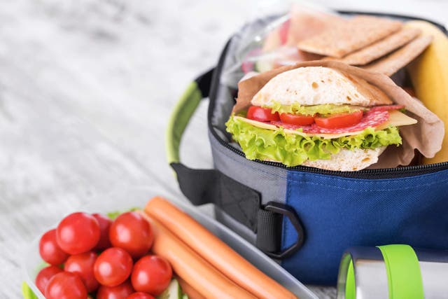 Households stocking up on lunchbox essentials helped drive an uptick in grocery spending last month (Alamy/PA)