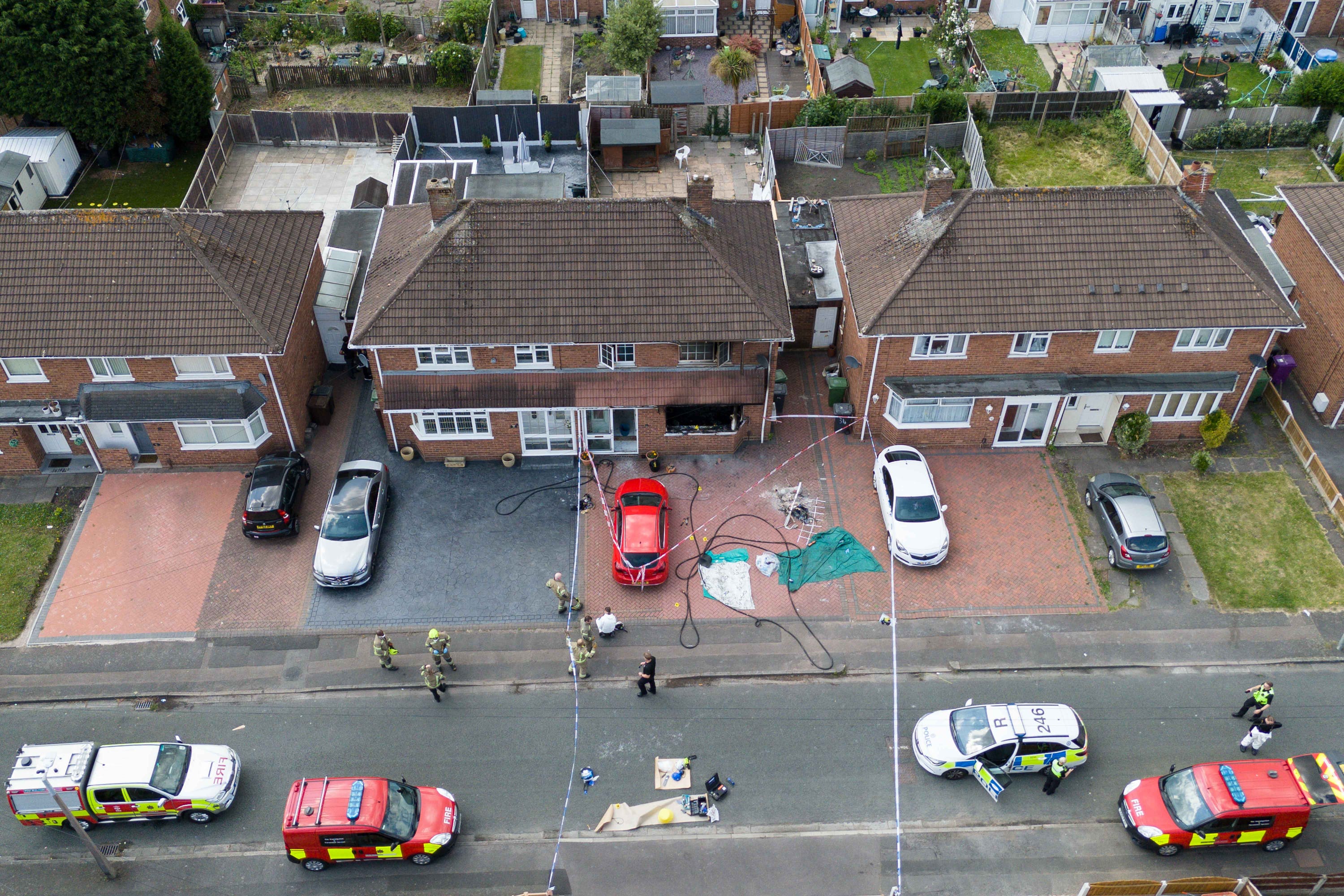 Emergency services at the scene in Plascom Road in Wolverhampton after the fatal fire (Jacob King/PA)