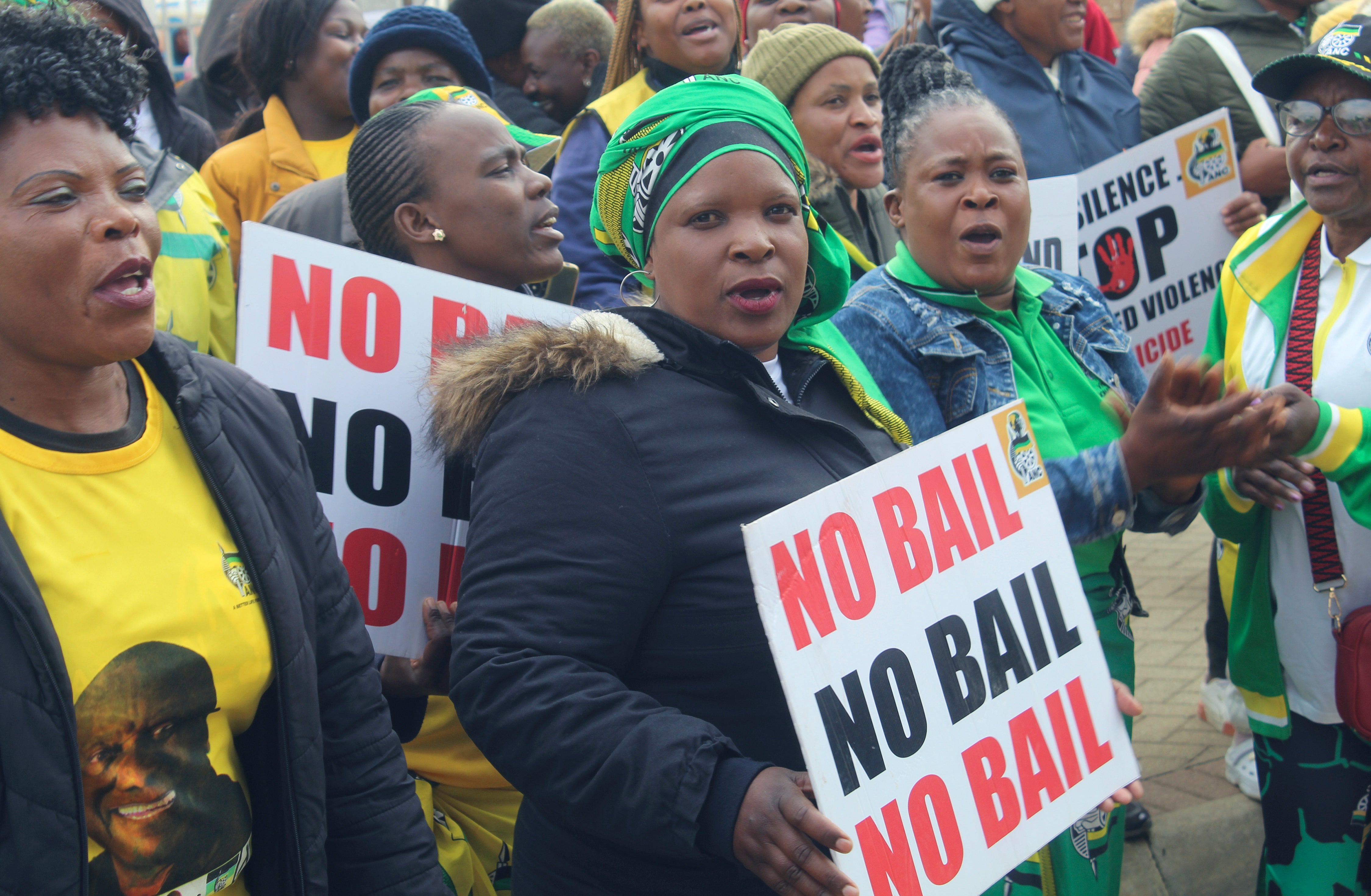 Protestors demonstrate outside the court in Polokwane South Africa, Tuesday, Sept. 10, 2024