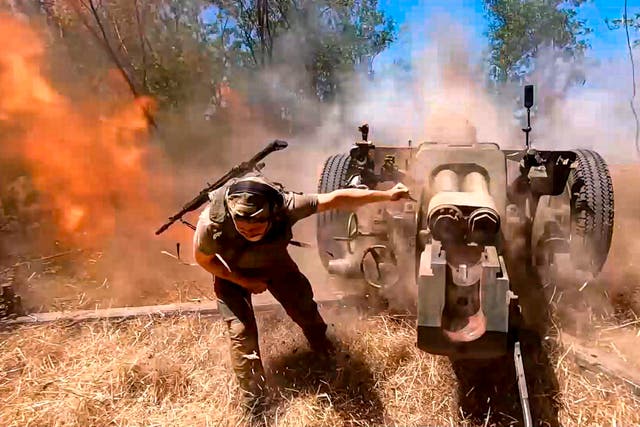 <p>A Russian soldier fires from D-30 howitzer towards Ukrainian positions in an undisclosed location in Ukraine</p>