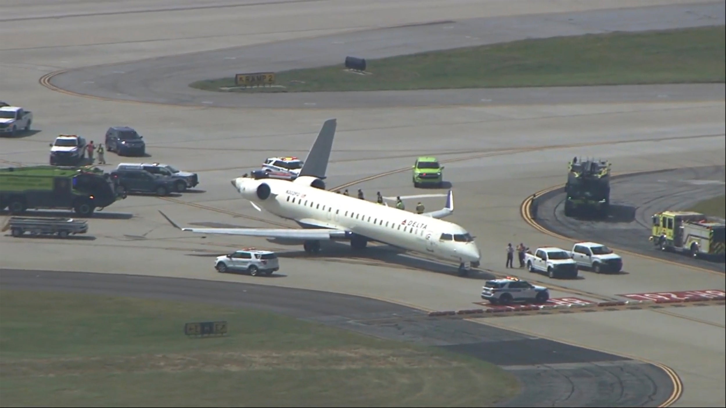 A plane sits damaged at Hartsfield-Jackson Atlanta International Airport after colliding with another plane