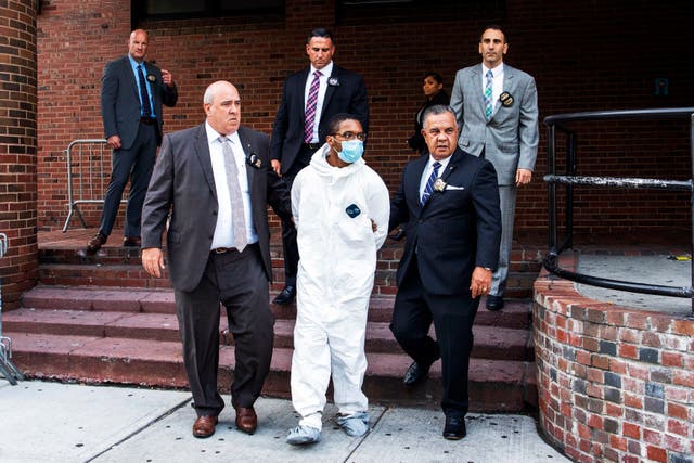 <p>Tyrese Haspil is escorted out of the 7th precinct by NYPD detectives, July 17, 2020, in New York.</p>