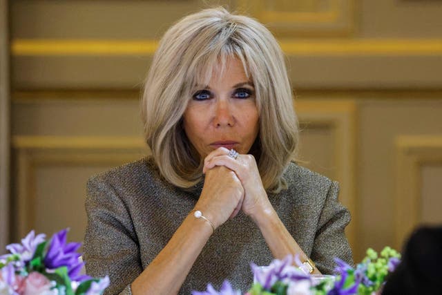 <p>French president's wife Brigitte Macron reacts during a dinner at the Elysee Palace in Paris on 30 September 2021 </p>