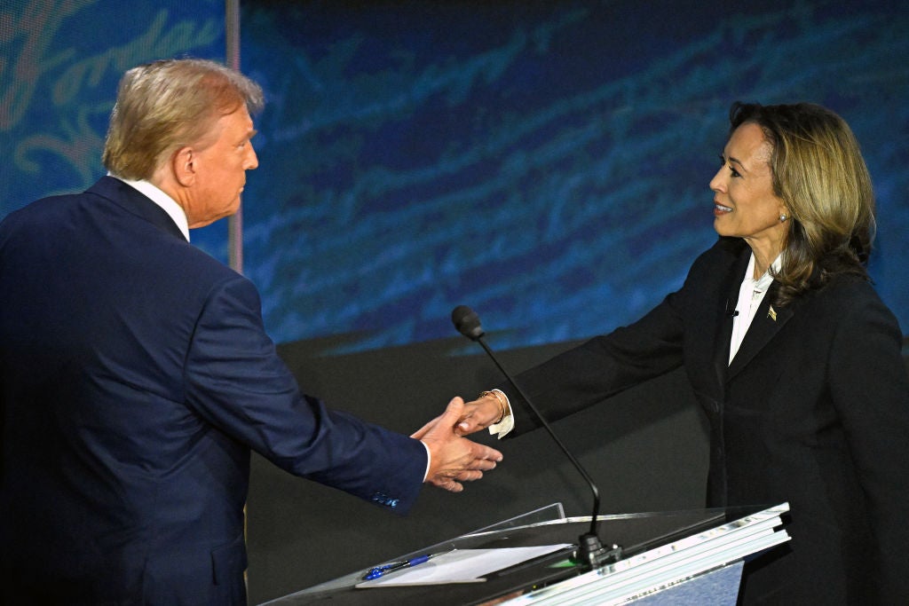 Kamala Harris and Donald Trump shake hands as they meet onstage for the first time on Tuesday evening