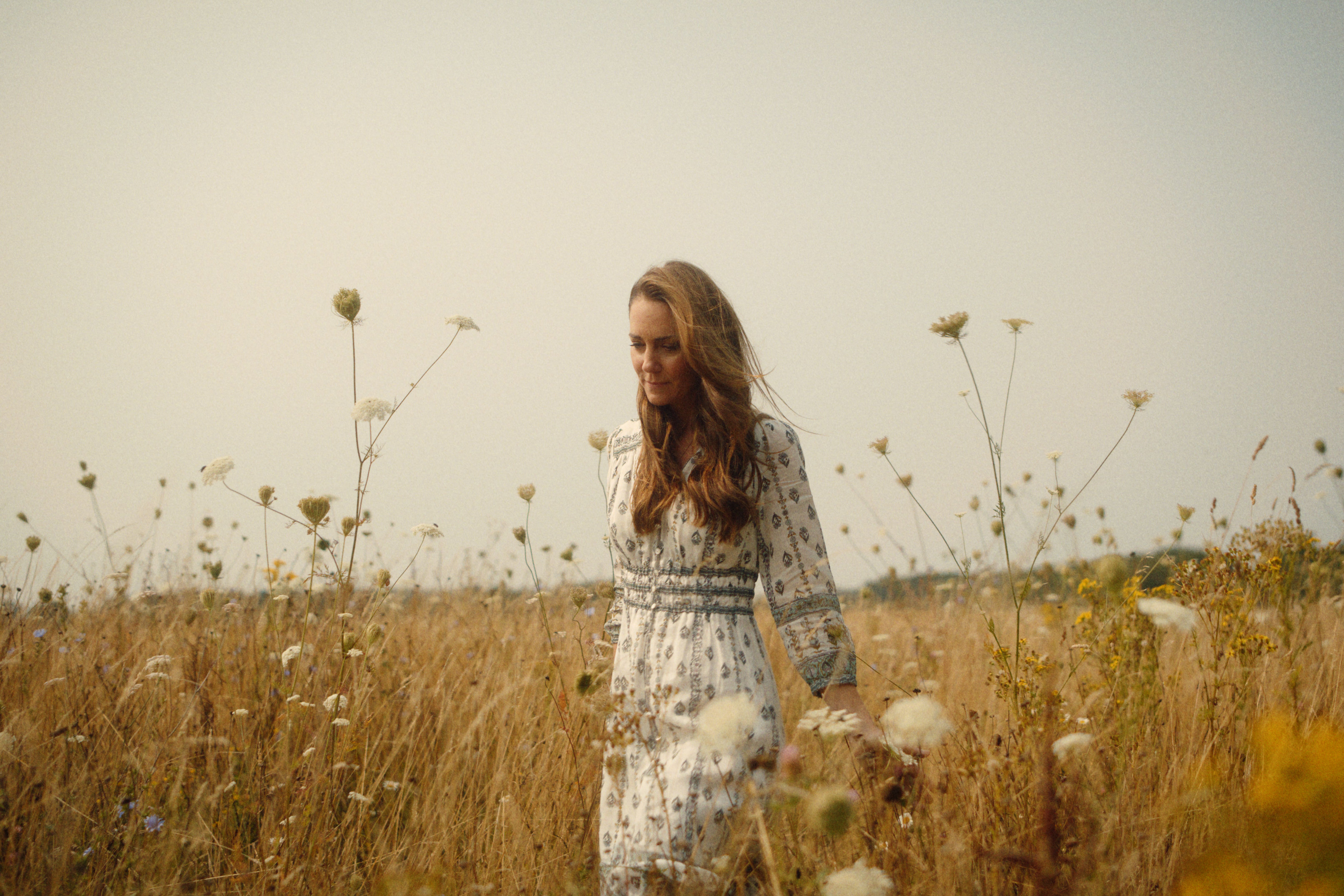 The Princess of Wales reflected on an ‘incredibly tough’ period in her life with her family. She wore a long white and blue dress for much of the video (Will Warr/Kensington Palace)