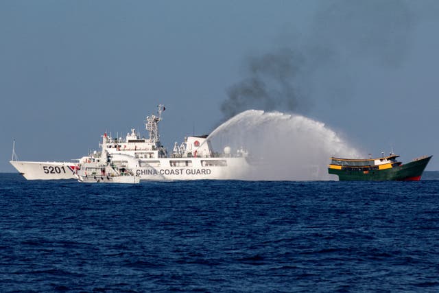 <p>File: Chinese Coast Guard vessels fire water cannons towards a Philippine resupply vessel Unaizah on its way to a resupply mission at Second Thomas Shoal in the South China Sea, 5 March 2024</p>