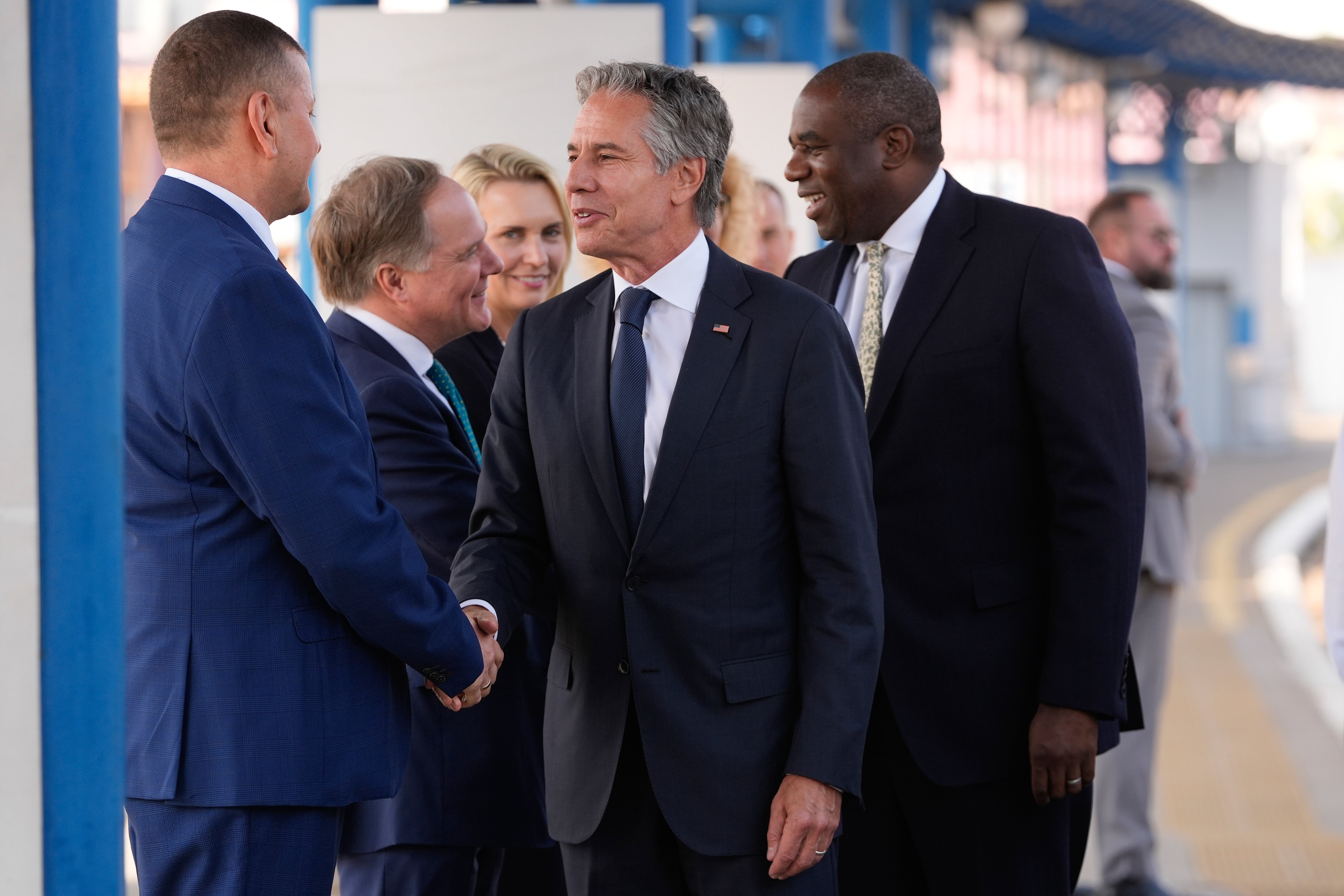 U.S. Secretary of State Antony Blinken and British Foreign Secretary David Lammy are greeted as they arrive at the train station in Kyiv