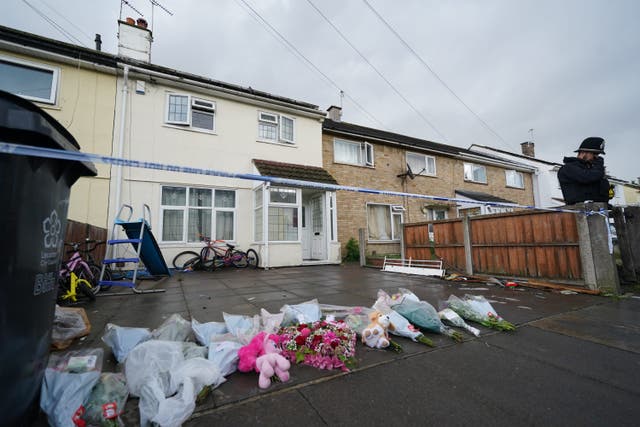 Flowers and tributes left at the scene of a house fire in Bedale Drive, Leicester (Jacob King/PA)