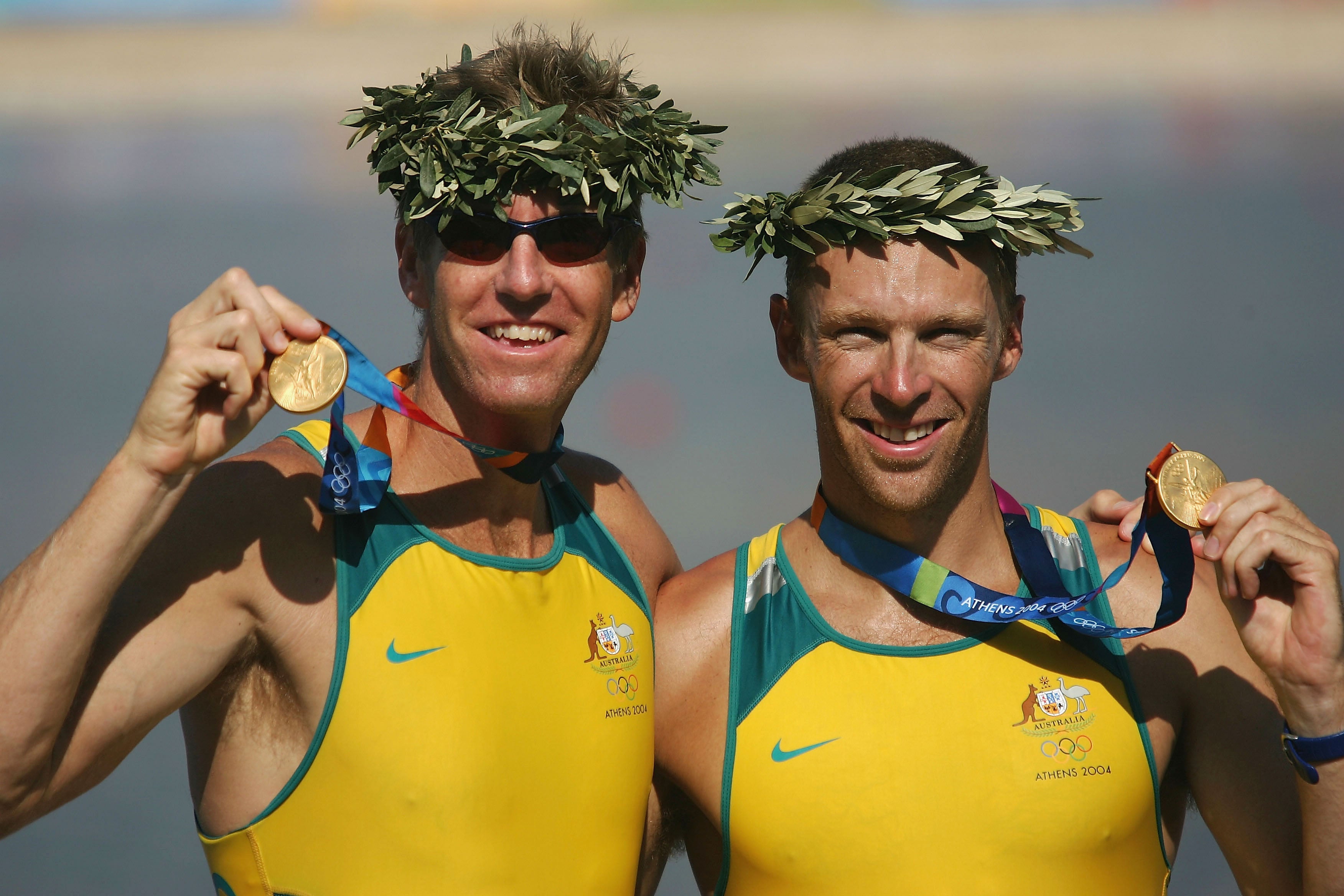 Drew Ginn, right, poses with James Tomkins after winning gold at Athens 2004